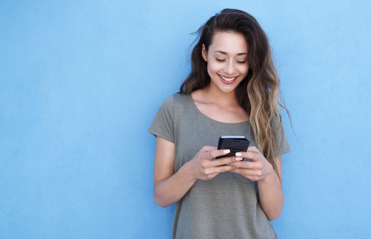 A woman looking at a phone
